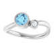 Dainty and feminine, this gemstone ring sets an elegant tone. The ring is set in platinum.