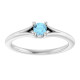 Dainty and feminine, this gemstone ring sets an elegant tone. The ring is set in platinum.