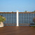 Trex Transcend Classic White 6x6 composite post sleeve installed on waterfront deck with brown railing and black aluminum balusters.