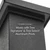 Close-up view of a textured aluminum post with a fitted cap. White overlay text reads "Compatible by Design" and "Works with Trex Signature & Trex Select Aluminum Posts." The image emphasizes material finish, clean lines, and product compatibility messaging. Background is minimal and white, keeping focus on the post and the text.