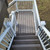 Staircase with Trex Select T-Rail and square composite balusters in white.