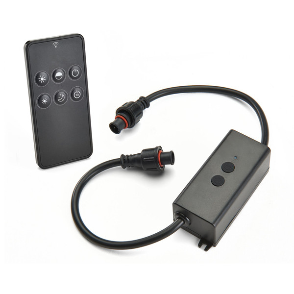 A black wireless remote control is shown next to an inline electronic connector module on a white background. The remote features several round buttons with power and brightness icons, suggesting lighting or device control functions. The module includes two circular buttons, indicator lights, and a cable with waterproof-style connectors at each end. The clean studio setting emphasizes the product details and modern, minimal design.