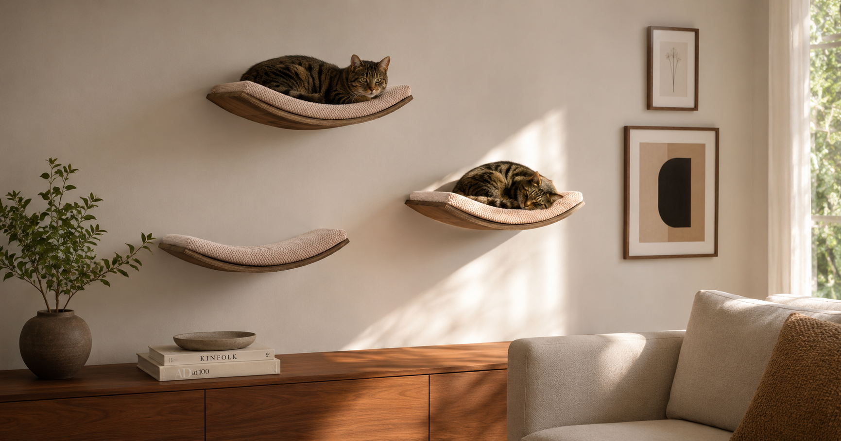 Three cat wall shelves arranged at staggered heights in a modern living room -- CatsPlay.com