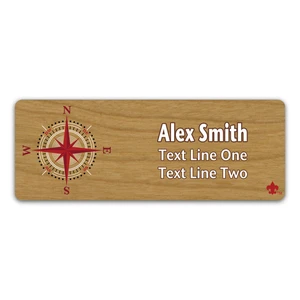 Compass Rose on Scout name tag. Compass image in Red and White ink with Scouting America Fleur-De-Lis on Cherry Wood