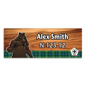 Wood Badge Name Tag with Wood Badge Tough Bear Critter on strip of Tartan design with Wood Badge Logo Wood Badge Name Tag with Wood Badge Tough Bear Critter on strip of Tartan design with Wood Badge Logo