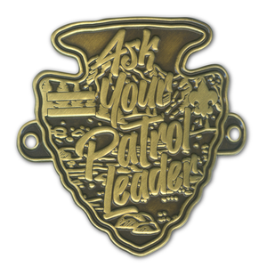 Antique brass-finished medallion in a rugged arrowhead shape, featuring bold, engraved text "Ask Your Patrol Leader" Hiking Stick Medallion by ClassB Antique brass-finished medallion in a rugged arrowhead shape, featuring bold, engraved text "Ask Your Patrol Leader" Hiking Stick Medallion by ClassB