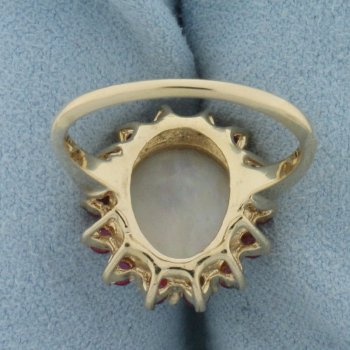 Opal and Ruby Halo Ring in 14k Yellow Gold