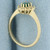 Emerald and Diamond Halo Ring in 14k Yellow Gold