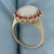 Opal and Ruby Halo Ring in 14k Yellow Gold