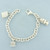 Tiffany and Co. Vintage Charm Bracelet with Taxi, Shopping Bag, Atlas Cube Charms