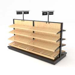 Retail bakery gondola display island featuring angled wooden slat shelves and chalkboard header signage for merchandising fresh bread and bagels.