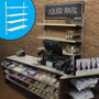 Retail wall display shown behind counter in liquor store configuration with shelves, bottles, and signage. Inside image shows base shelf.