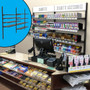 Behind-the-counter retail wall display selling cigarettes, cigars, loose leaf tobacco and related accessories.