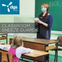 Personal Sneeze Guard With Access Hole Made By DGS Retail And Used On A Teacher's Desk In A School Classroom