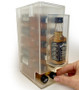 mini liquor 50ml bottle dispenser display used for nips, shooters and airplane bottles on top of checkout counters at retail convenience stores