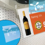 Large Shelf Edge Label Holder with an Adhesive back displaying wine talker price tags and sale signs at retail convenience stores