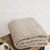 B888 033 BEIGE Colour Supersoft Merino Wool Blanket with Irish Heritage Design Folded View ShopAran.com