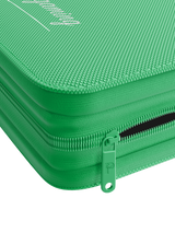Durable green steel zipper on Palms Off Gaming 4 pocket top loader binder, keeping 35pt top loaders for Pokémon, MTG, One Piece and more safe.