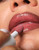 Putty Pure Gloss Balm Lip Colour on model