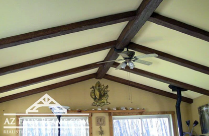 faux reclaimed wood beams installed on living room ceiling