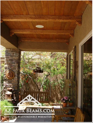 faux reclaimed wood beams installed as panels on the ceiling of an outdoor patio
