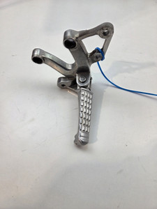 LH Foot peg and mount  Triumph Speed Triple 1050 08-10 T2080894