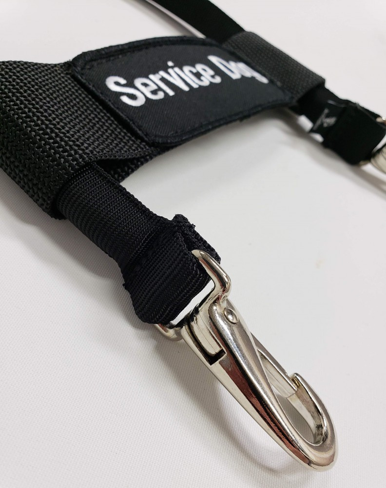 Durable nylon clip-on bridge handle connected to a service dog harness for comfortable control.