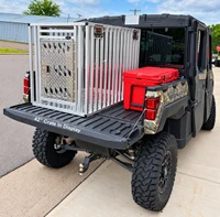Full vent dog crate mounted in UTV cargo bed
