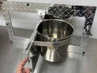 Angled view of aluminum Swinging Double Diner kennel feeder with two removable stainless steel buckets