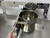 Angled view of aluminum Swinging Double Diner kennel feeder with two removable stainless steel buckets