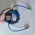 1:1 shortwave common-mode choke (or balun) / RF noise suppressor coil wound with a blue cable around a magnetic ring and fitted with coaxial connectors (such as PL-259 / SO-239)