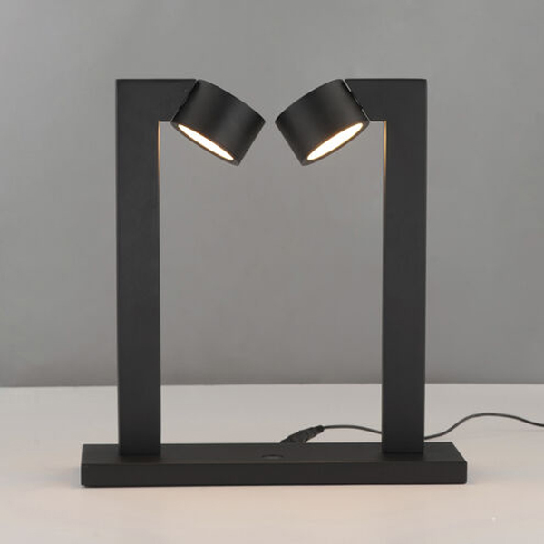 Adjustable task lamp on desk workspace
