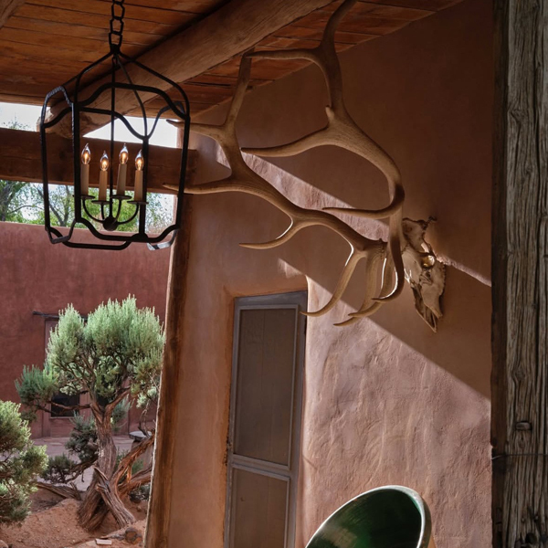 Hanging outdoor lantern illuminating covered porch