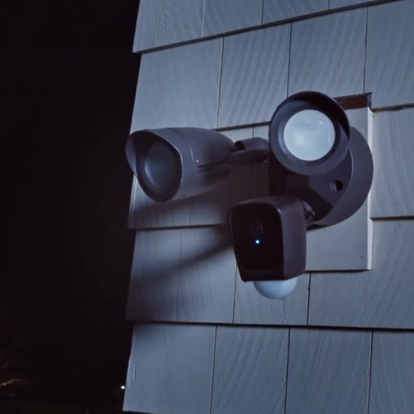 Motion-sensing security light mounted above garage