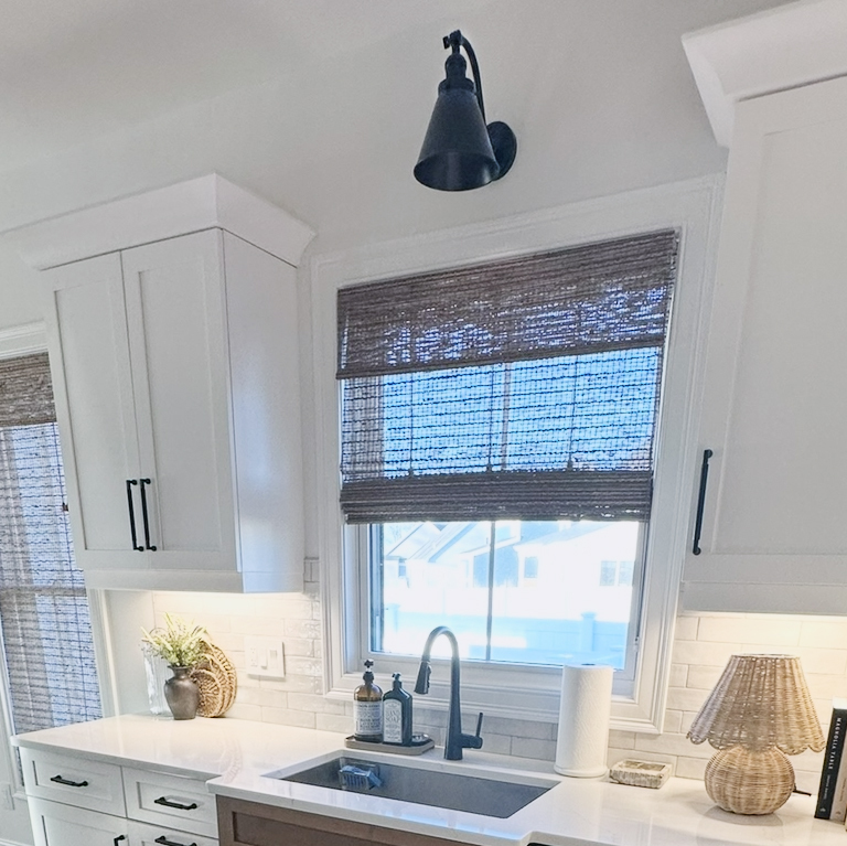 wall sconce over a kitchen sink