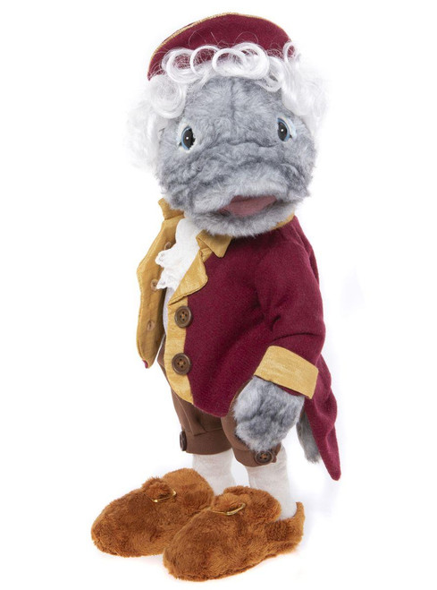 A grey plush bear stands upright wearing an 18th-century style burgundy coat with gold trim, white curly wig, tricorn hat, brown breeches, and fuzzy brown buckled shoes.