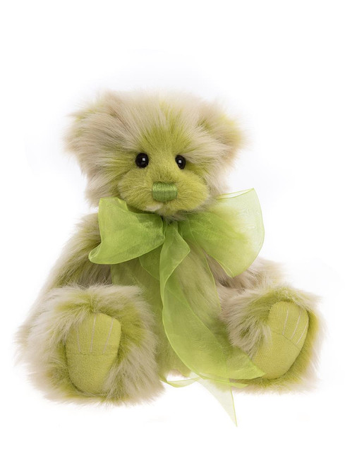 A green and cream plush Charlie Bears teddy bear sits upright, adorned with a sheer lime green ribbon bow tied at its neck, against a white background.