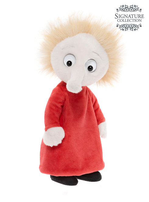 A plush toy figure stands upright against a white background, wearing a red dress, with white skin, large googly eyes, a protruding nose, and wild blonde hair.