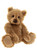 A golden-brown Charlie Bears teddy bear sits upright against a white background, featuring shaggy fur, small dark eyes, a dark nose, and suede-like paw pads.