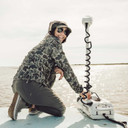 Model on Boat Image of the LaCrosse Women's 6" Alpha Deck Boot.