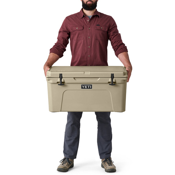 Model Holding the Cooler Image of the Yeti Tundra 65 Hard-Sided Cooler.