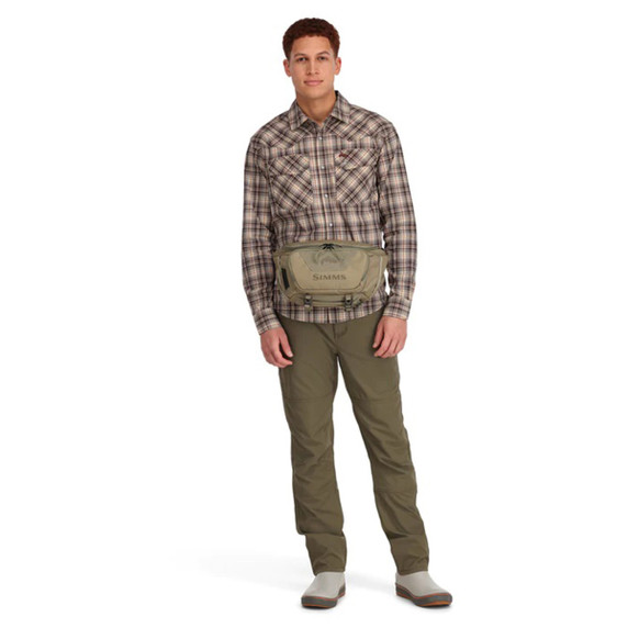 Simms Tributary Fishing Hip Pack Model Image in Tan