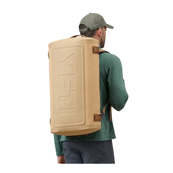 Yeti Panga 50L Waterproof Duffel Backpack Model Image in Tan
