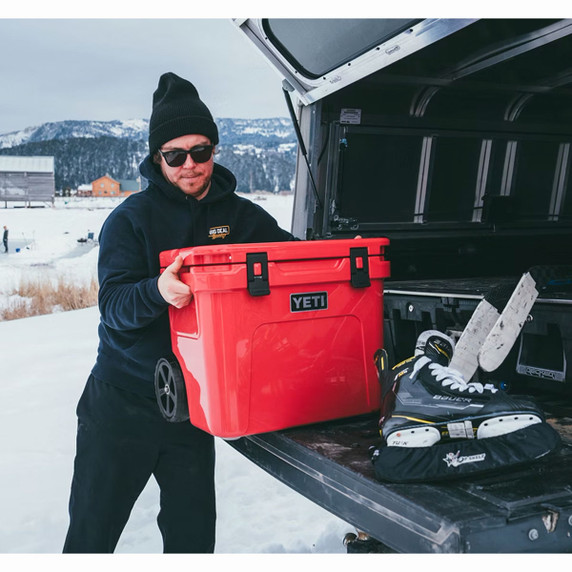 Lifestyle 5 Image of the Yeti Roadie 32 Wheeled Cooler.