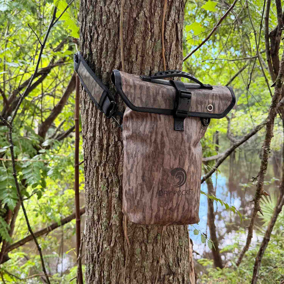 Hanging on Tree Image of the Dry Pocket Waterproof Floating Shell Bag.