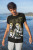 man wearing nanami kento jjk anime tee at the beach
