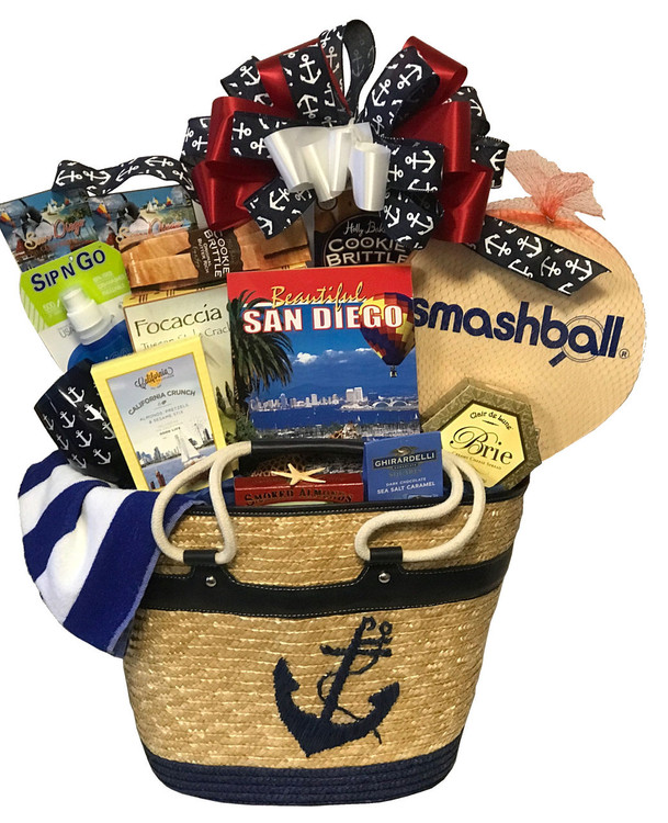 This gorgeous over sized, high end, designer tote bag makes for a striking nautical presentation. This is a perfect raffle prize for a nautical themed event (when you want to make a really big splash! , a huge             
 " Welcome To San Diego!,"  or a special housewarming gift for someone who just got their dream home by the ocean! The tote bag can be used as a magazine basket in the home, or used for picnics, day at the beach or boating. Includes a towel, sip and go water bottle, Beautiful San Diego (book), paddle ball game, California Crunch snack mix, cheese, crackers, assorted cookies and confections, California almonds, an unbreakable stemless wine glass with anchor design and more.