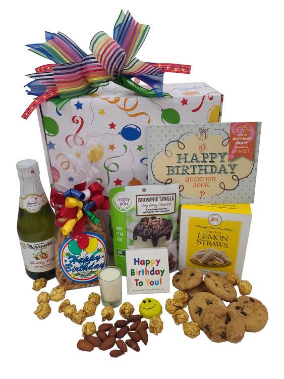 We fill this festive birthday box with yummy snacks and fun little gifts! It includes:

A delicious chocolate mug cake (just mix with water in a mug and it  bakes in the microwave in minutes)
Almonds
Mini Sparkling Cider
small candle
Birthday Matches
Smiley Faced Chocolate
Caramel Corn
Lemon Straw Cookies
Apricot Cookies
Birthday Snack Mix
Happy Birthday Questions Book (A fun conversation starter!)
Chocolate Chip Cookies






