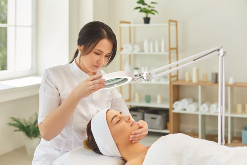 Daylight Co. Magnifying Lamp, MAG Lamp S, In Use During Facial Treatments 