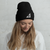White B Mark Logo Beanie, front view on a model.